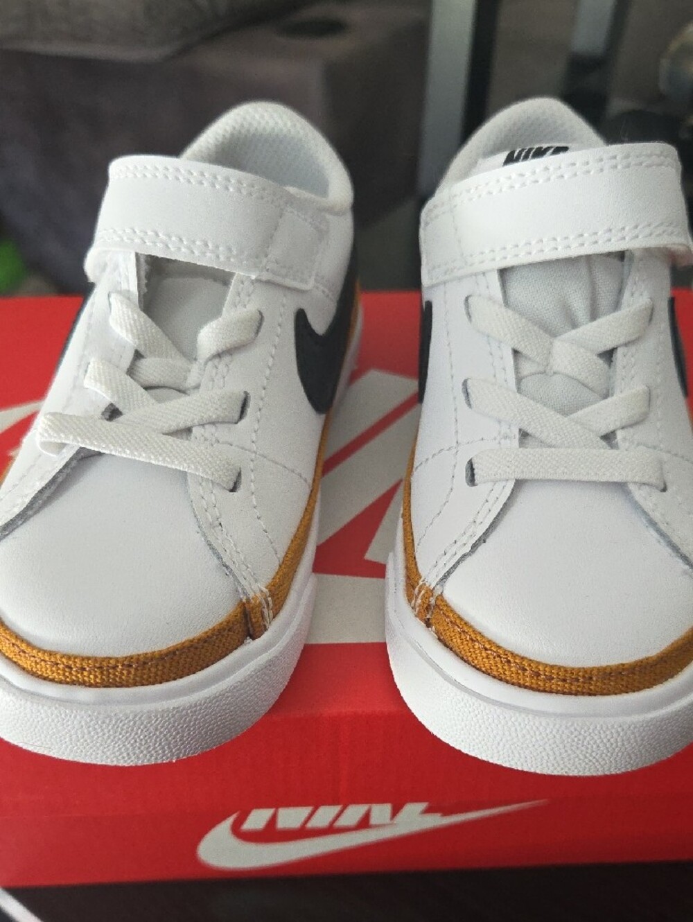 Nike Kids White Sneakers with Black Swoosh and Gold Accent - Picture 3 of 8